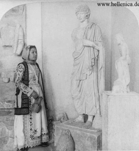 A woman in front of the Antinous sculpture 1.83 m Museum of Eleusis Inv. 5092